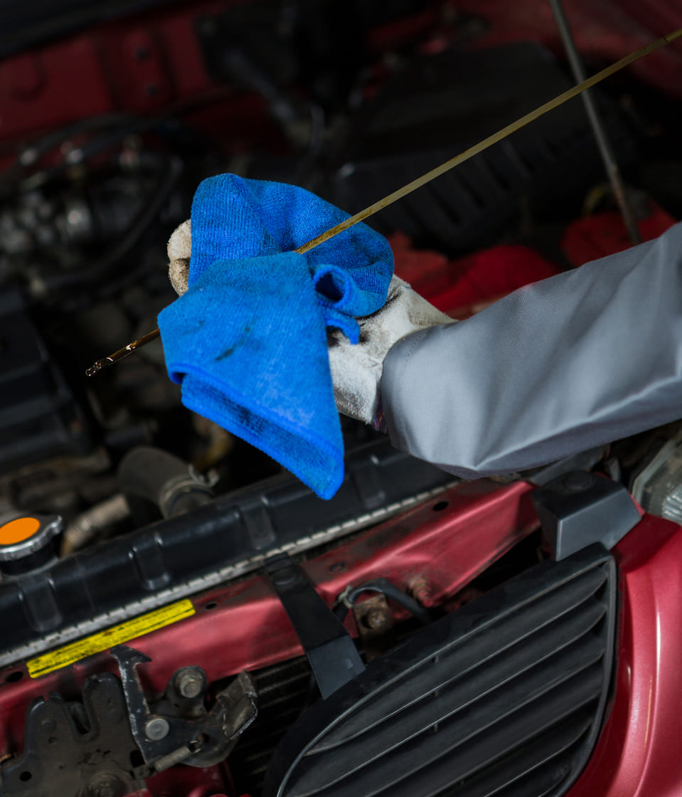 mechanic-checking-oil-level-car-engine-3 img-12