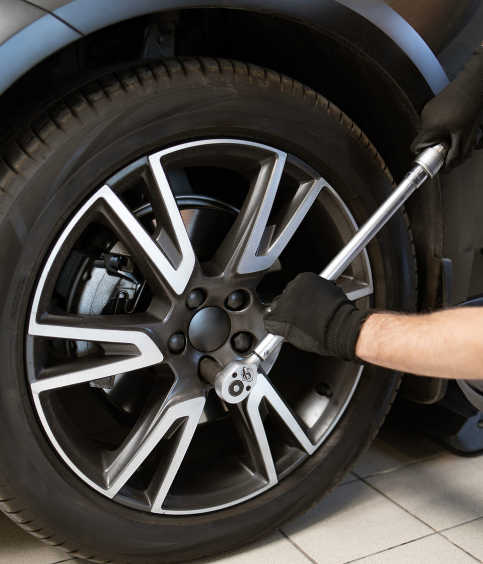 mechanic-tightening-wheel-nuts-with-wrench-in-auto-2024-12-14-05-11-42-utc-3 img-13
